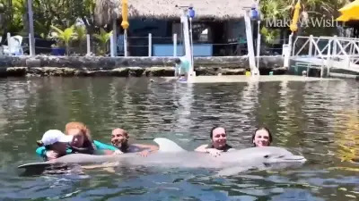 Teen struggling with rare condition swims with dolphins as part of Make A Wish Southern Florida’s mission