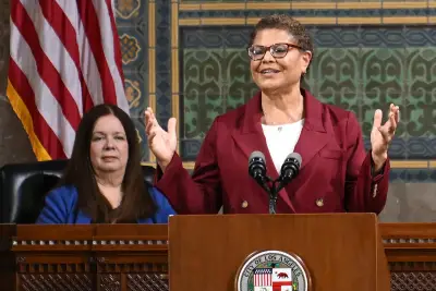 Mayor Karen Bass says she has reached a deal to restore police officer hiring